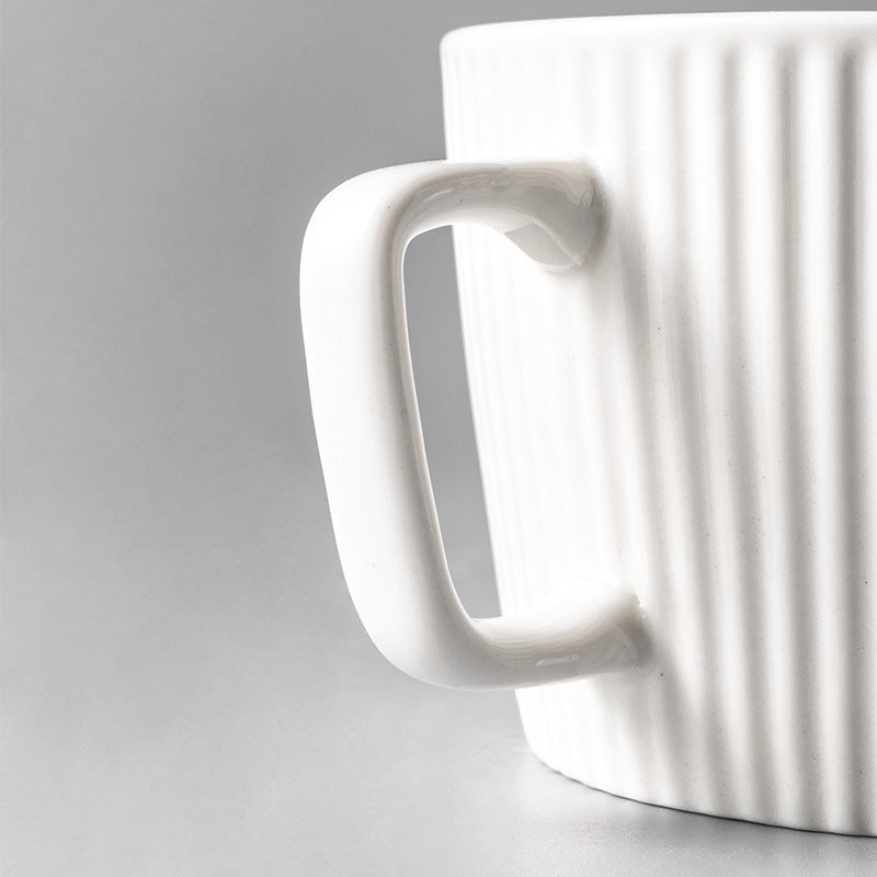 Handle side of Vintage Style Ribbed Mug in Vanilla Steamer color.