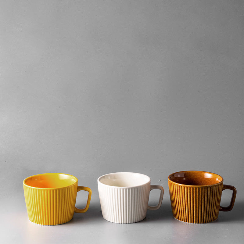 3 Vintage Style Ribbed Mugs, side by side on a light gray backdrop in  Tumeric Latte, Vanilla Steamer & Caramel Mocha colors.