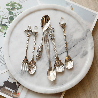 Medieval-Style Retro Coffee Spoons Set in Silver, all together on a plate