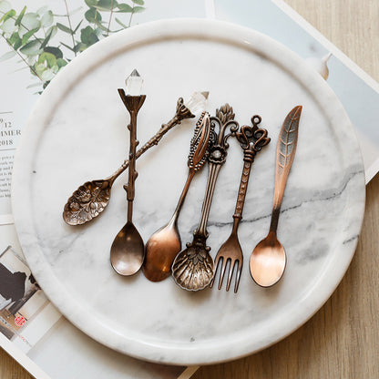 Medieval-Style Retro Coffee Spoons Set in Dark Copper, all together on a plate