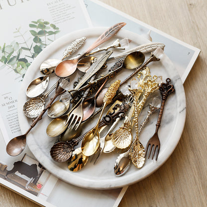 Medieval-Style Retro Coffee Spoons Set in Gold, Dark Copper, and Silver, all together on a plate