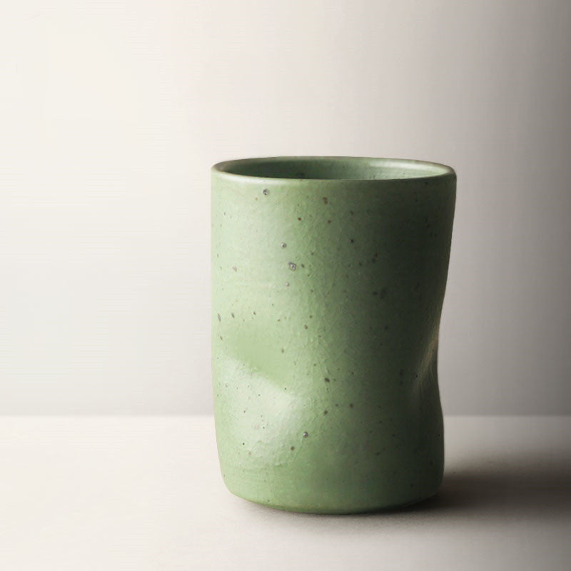 Misshapen Magic Japanese Style Tea Cup Mug in matcha green color.