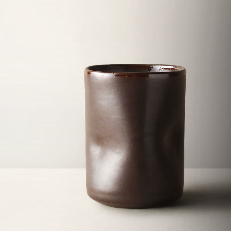 Misshapen Magic Japanese Style Tea Cup Mug in mocha brown color.