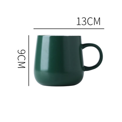 Dark Green "Keep 'Er Warm" Mug with product dimensions typed out.