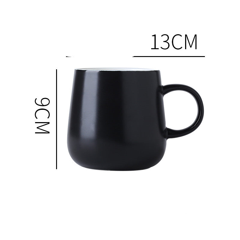 Black "Keep 'Er Warm" Mug with product dimensions typed out.