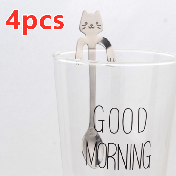 Hanging Cat Spoon in Silver on glass cup that says good morning