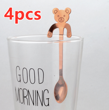 Hanging Bear Spoon in Rose Gold on glass cup that says good morning