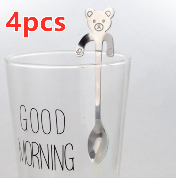 Hanging Bear Spoon in silver on glass cup that says good morning