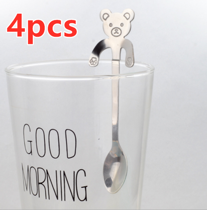 Hanging Bear Spoon in silver on glass cup that says good morning