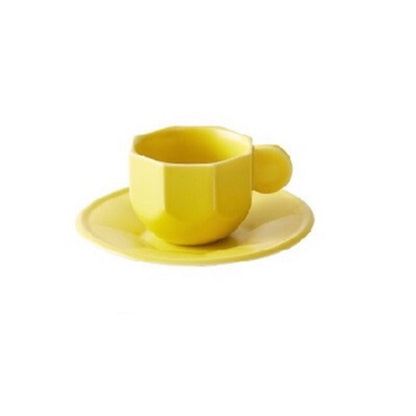 Yellow Octagonal Shaped Mug with Macaron Handle and saucer on white background.