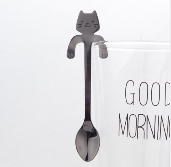 Hanging Cat Spoon in Black on glass cup that says good morning