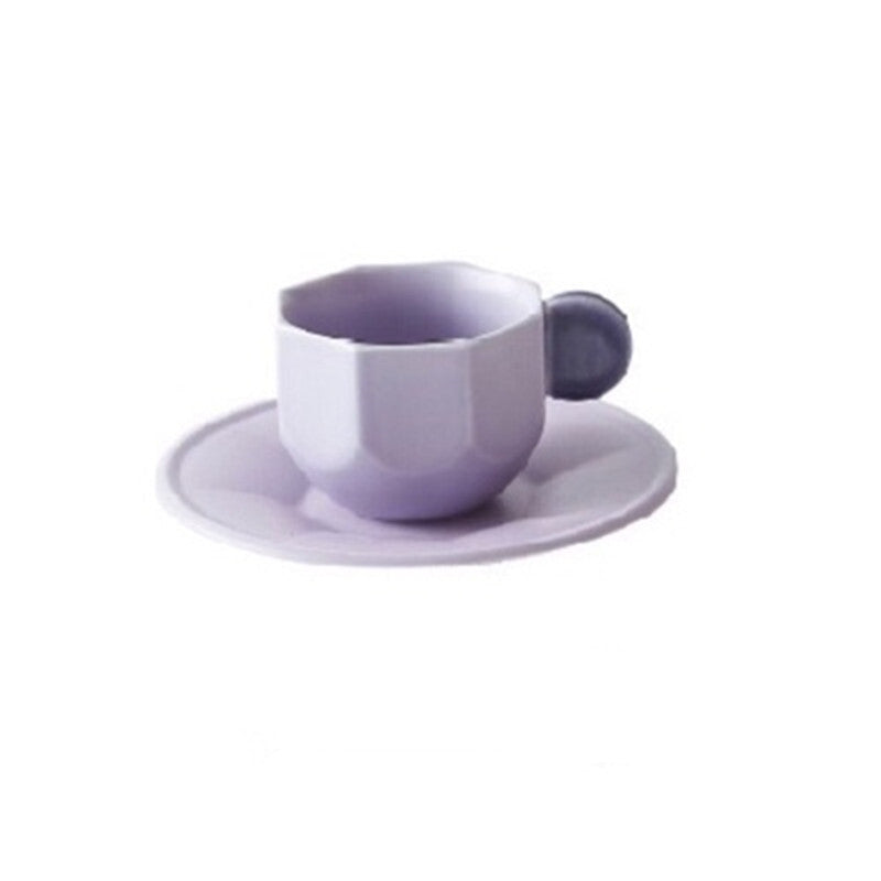 Purple Octagonal Shaped Mug with Macaron Handle and saucer on white background.