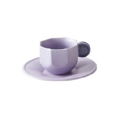 Purple Octagonal Shaped Mug with Macaron Handle and saucer on white background.