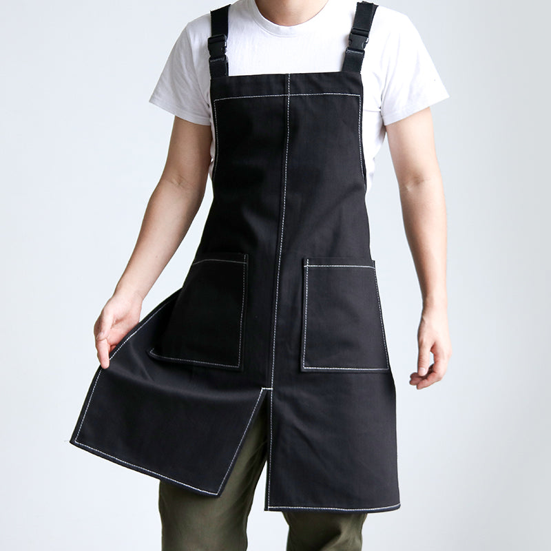 Person wearing Cut-Away Style Denim Apron in Classic Black