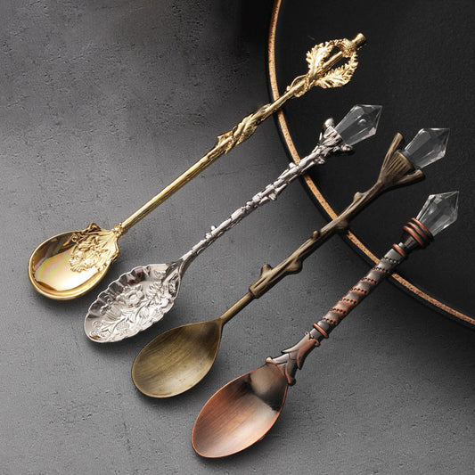 4 assorted Retro spoons in gold, silver, cyan, and copper.