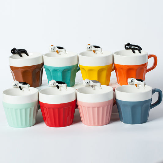 White background with 8 different mugs pictured together in the following colors/styles: Coffee Brown (with Black Cat), Turquoise Green (with White Tortoiseshell Cat) , Yellow ( with White Tortoiseshell Cat), Orange (with Black & White Cat)Pale Peppermint Green (Thin-Ribbed with Black & White Cat), Red mug (Thin-Ribbed and with Black & White Cat),  Pink ( thin-ribbed with White & Gray Cat),  and  Blue mug (with White Tortoiseshell Cat). Organe mug in photo is not an option to order.