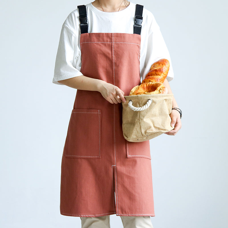 Person wearing Cut-Away Style Denim Apron in Salmon Pink