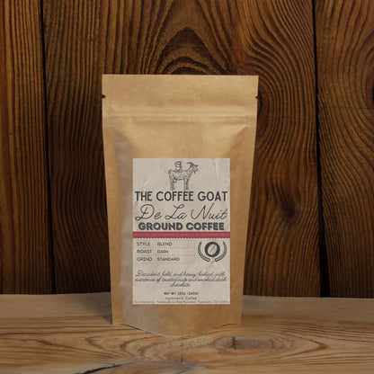 A brown kraft paper bag of De La Nuit ground coffee in standard grind by The Coffee Goat