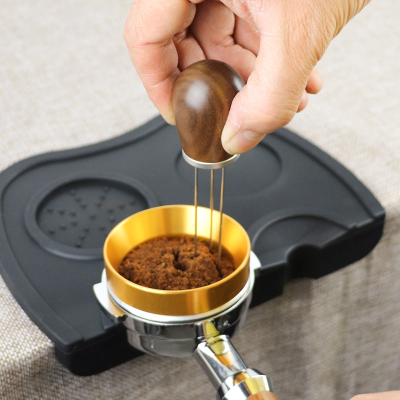 Persob using Wooden Handle Espresso Distribution Tool 