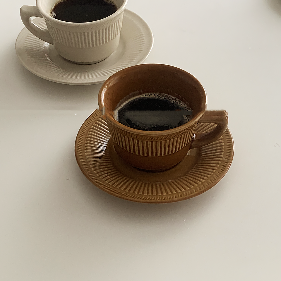 2 coffee cup and saucer sets . One is in Cappuccino Brown color and the other is in White Sugarcolor.