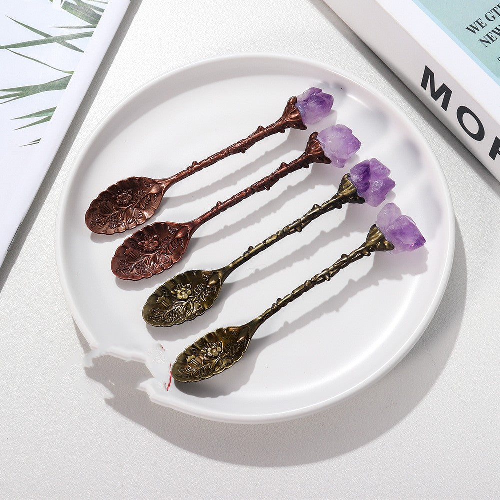 4 Natural Amethyst Crystal Spoons on a white plate on a table