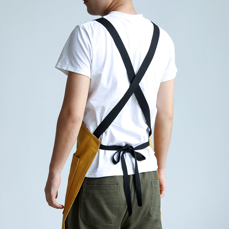 Person wearing Cut-Away Style Denim Apron Mustard Yellow