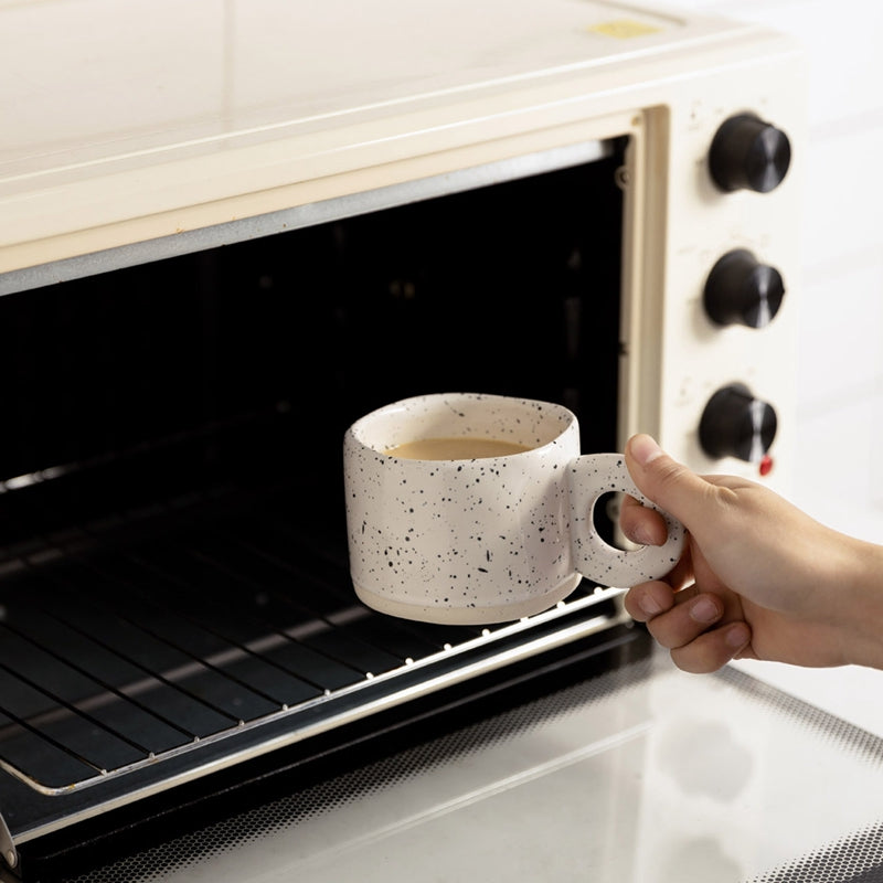 Handcrafted Speckled Ceramic Mug Cookies & Cream color and going into a toaster oven.